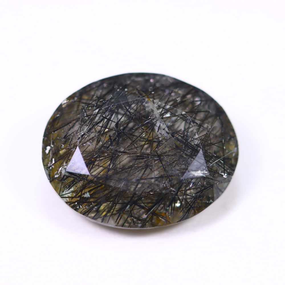 10.29ct Black Rutiled Quartz - Polished Faceted , 990E: Ksmith Heritage Auctioneers Subject: Natural Black Rutiled Quartz Carat Weight: 10.29ct Dimension: 16.7 x 13.5 x 7.2mm