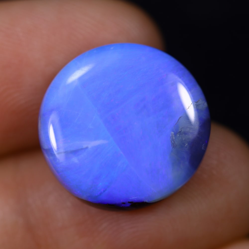 11.46Ct Blue Boulder Opal - Australian Opal , 231E: Ksmith Heritage Auctioneers Subject: Natural Boulder Opal Origin: Australia Carat Weight: 11.46Ct Dimension: 16.3x15.7x5 mm Treatment: Natural Untreated Type: Cabochon, Po