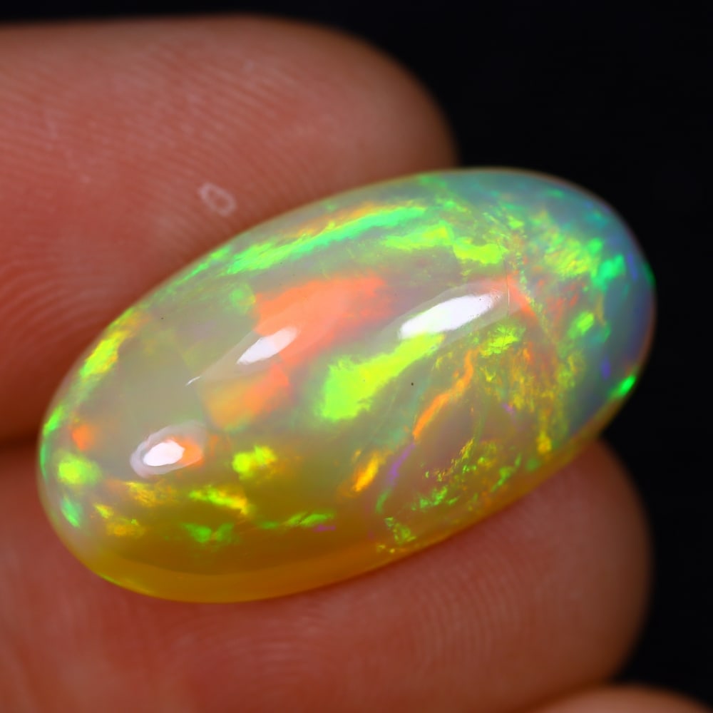10.80Ct Welo Opal Polished - Ethiopian Opal , 145E: Ksmith Heritage Auctioneers Subject: Natural Ethiopian Welo Opal Origin: Ethiopia Carat Weight: 10.80Ct Dimension: 22.5x12.5x7.7 mm Treatment: Natural Untreated Type: Face