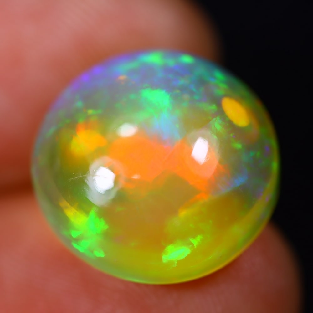 *8.75Ct Welo Opal Polished - Ethiopian Opal - Round Cabochon, 481B: Ksmith Heritage Auctioneers Subject: Natural Ethiopian Welo Opal Origin: Ethiopia Carat Weight: 8.75Ct Dimension: 14.6 x 14.4 x 7.8 mm Treatment: Natural Untreated Shape: Round