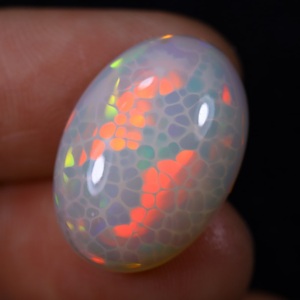 *13.96Ct Unheated Welo Opal Polished - Ethiopian Opal , 167E: Ksmith Heritage Auctioneers Subject: Natural Ethiopian Welo Opal Origin: Ethiopia Carat Weight: 13.96Ct Dimension: 21.5x15.1x8 mm Treatment: Natural Untreated Type: Caboc