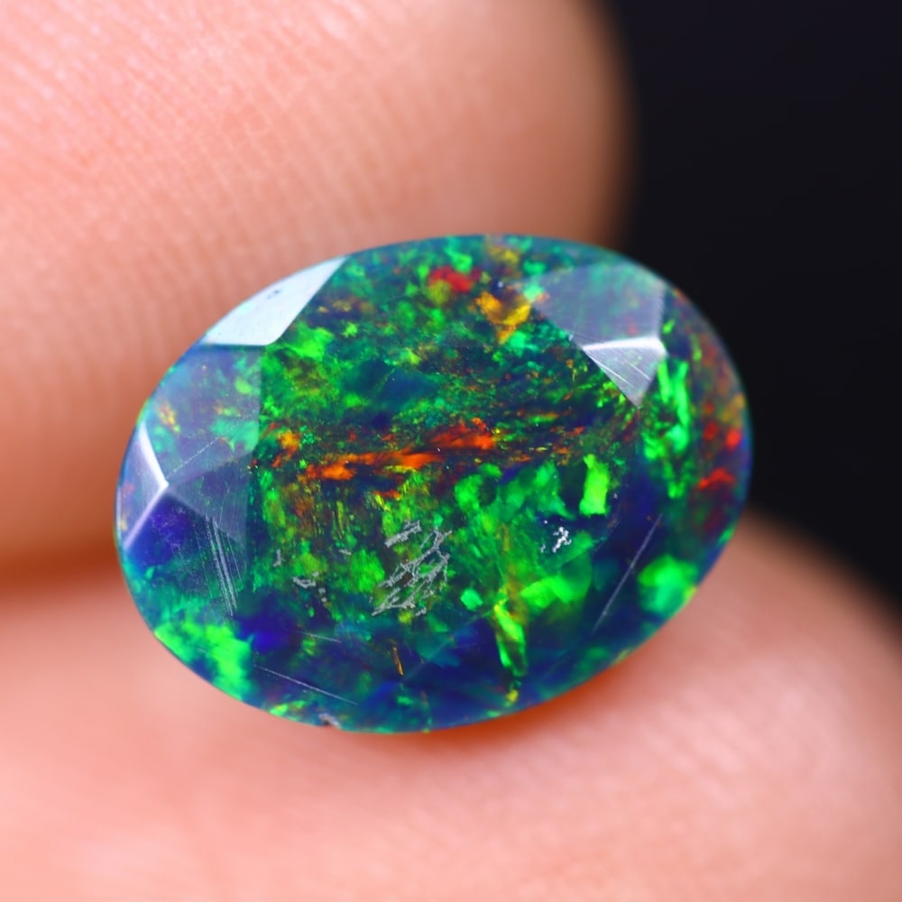 1.42Ct Welo Black Faceted Opal Polished - Ethiopian Opal , 228E: Ksmith Heritage Auctioneers Subject: Natural Ethiopian Welo Black Opal Origin: Ethiopia Carat Weight: 1.42Ct Dimension: 10.4x7.9x4.2 mm Treatment: Smoked Type: Faceted, Po
