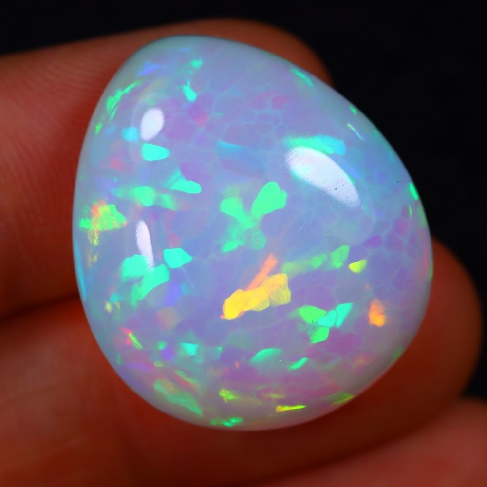 24.41Ct Welo Opal Polished - Ethiopian Opal - Pear Cabochon , 200E: Ksmith Heritage Auctioneers Subject: Natural Ethiopian Welo Opal Origin: Ethiopia Carat Weight: 15.44Ct Dimension: 26.3 x 13.3 x 7 mm Treatment: Natural Untreated Shape: O