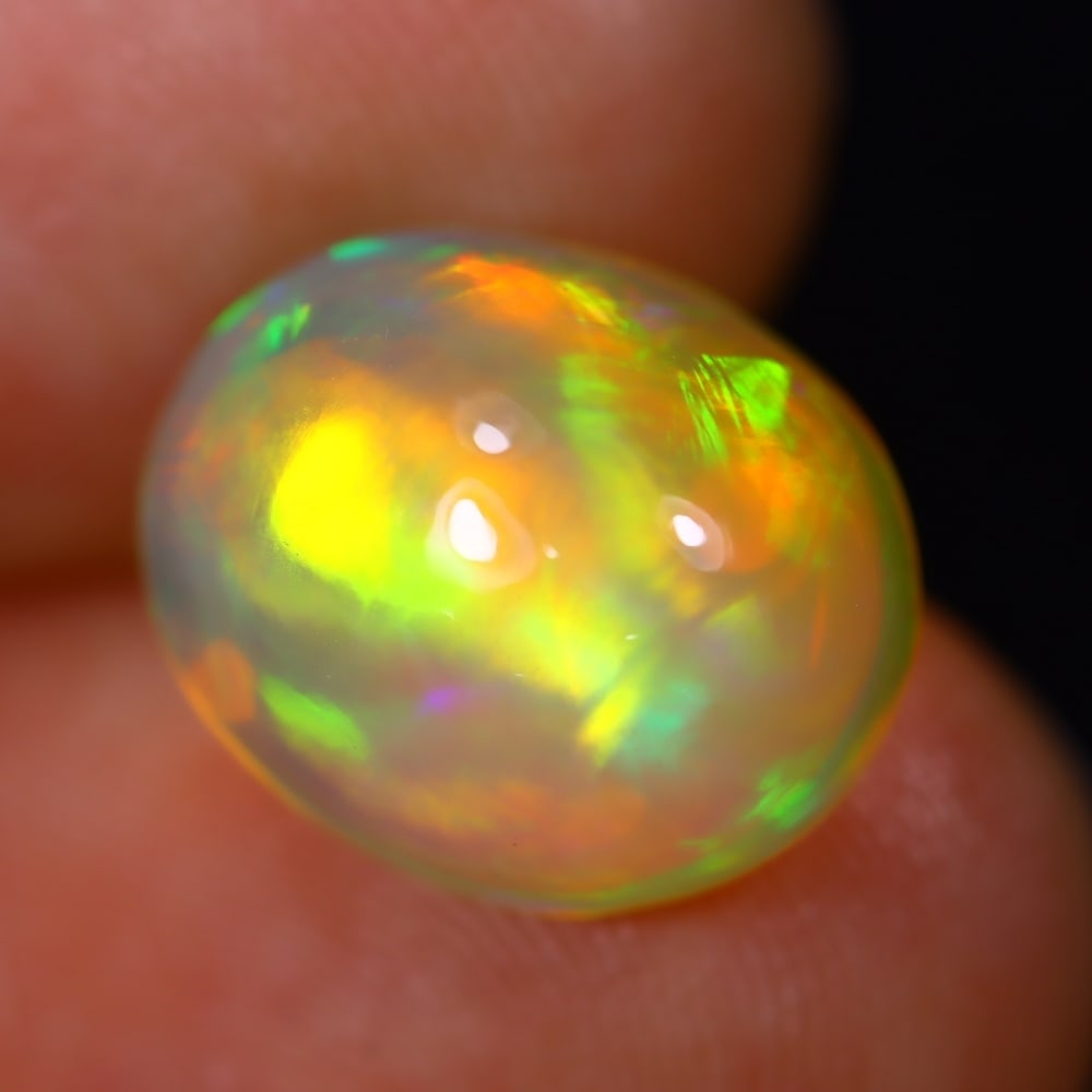 *4.39Ct Welo Opal Polished - Ethiopian Opal - Oval Cabochon, 432B: Ksmith Heritage Auctioneers Subject: Natural Ethiopian Welo Opal Origin: Ethiopia Carat Weight: 4.39Ct Dimension: 12.6 x 10.3 x 6.8 mm Treatment: Natural Untreated Shape: Oval