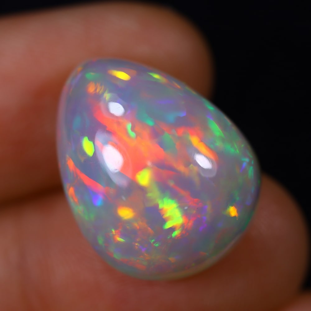 *15.02Ct Welo Opal Polished - Ethiopian Opal , 183E: Ksmith Heritage Auctioneers Subject: Natural Ethiopian Welo Opal Origin: Ethiopia Carat Weight: 15.02Ct Dimension: 19.4x15x11 mm Treatment: Natural Untreated Type: Cabocho