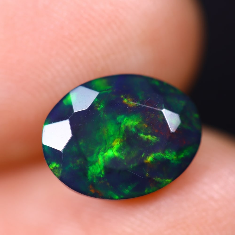 1.71Ct Welo Black Faceted Opal Polished - Ethiopian Opal , 947E: Ksmith Heritage Auctioneers Subject: Natural Ethiopian Welo Black Opal Origin: Ethiopia Carat Weight: 1.71Ct Dimension: 10.2x7.9x5.4 mm Treatment: Smoked Type: Faceted, Po