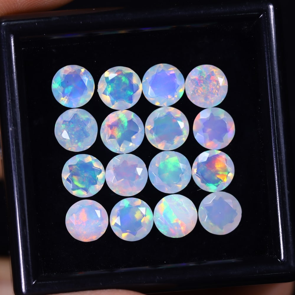 *8.56Ct 16pcs Calibrated 6x6mm Faceted Welo Opal Set - Ethiopian Opal , 110E: Ksmith Heritage Auctioneers Subject: Natural Ethiopian Welo Opal Origin: Ethiopia Carat Weight: 8.56Ct Treatment: Natural Untreated Type: Faceted, Polished