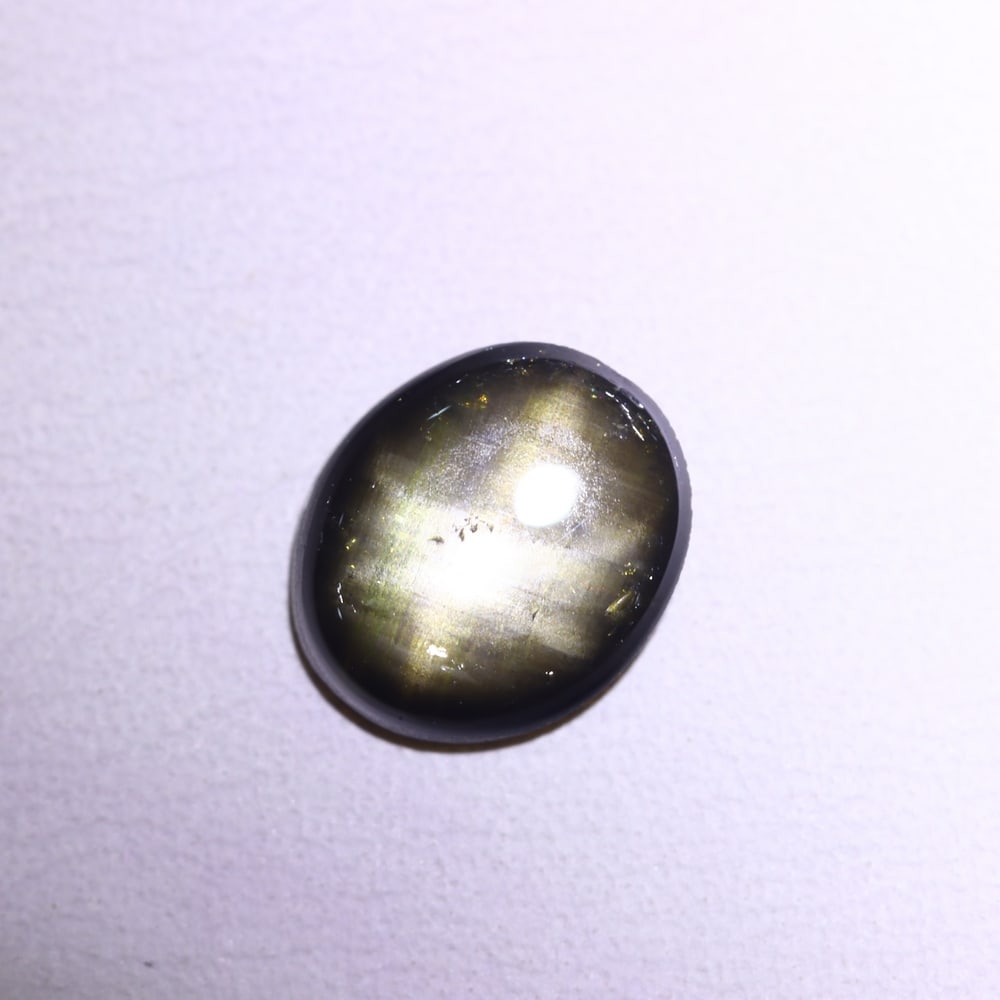 *2.04Ct 6 Rays Black Star Sapphire - Polished Cabochon , 1005E: Ksmith Heritage Auctioneers Subject: Natural 6 Rays Star Sapphire Origin: Myanmar Carat Weight: 2.04Ct Dimension: 8.6x7.3x2.7 mm Treatment: Diffusion Type: Cabochon, Polis