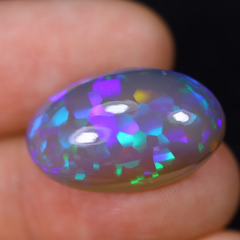 *12.41Ct Welo Opal Polished - Ethiopian Opal, 823B: Ksmith Heritage Auctioneers Subject: Natural Ethiopian Welo Opal Origin: Ethiopia Carat Weight: 12.41Ct Dimension: 21.2x13.1x8.2 mm Treatment: Natural Untreated Type: Cabochon,