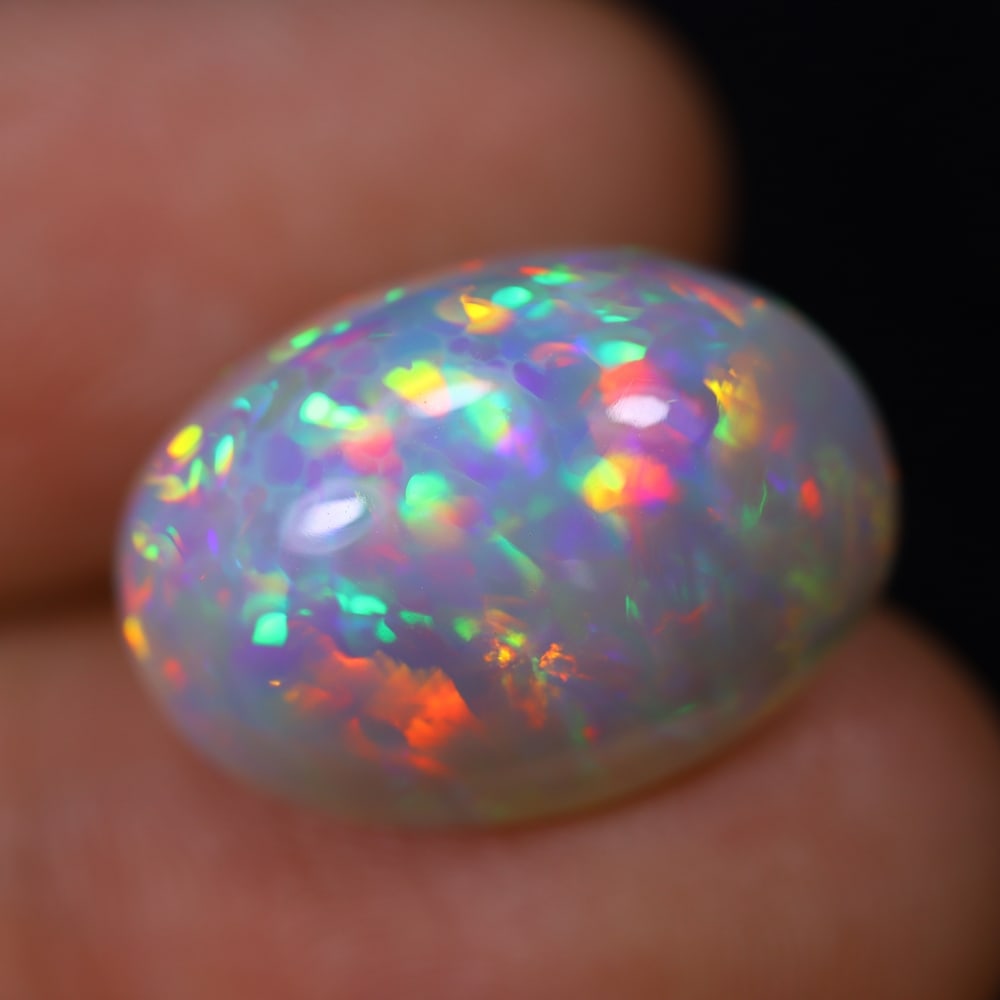 *11.79Ct Welo Opal Polished - Ethiopian Opal, 877B: Ksmith Heritage Auctioneers Subject: Natural Ethiopian Welo Opal Origin: Ethiopia Carat Weight: 11.79Ct Dimension: 18x12.9x10.1 mm Treatment: Natural Untreated Type: Cabochon,