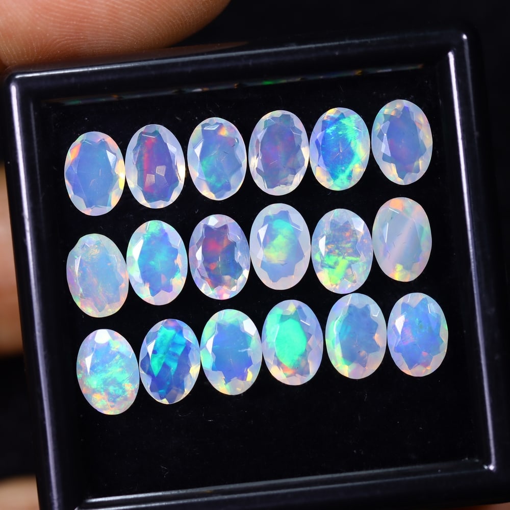 *8.76Ct 18pcs Calibrated 7x5mm Faceted Welo Opal Set - Ethiopian Opal, 874B: Ksmith Heritage Auctioneers Subject: Natural Ethiopian Welo Opal Origin: Ethiopia Carat Weight: 8.76Ct Treatment: Natural Untreated Type: Faceted, Polished