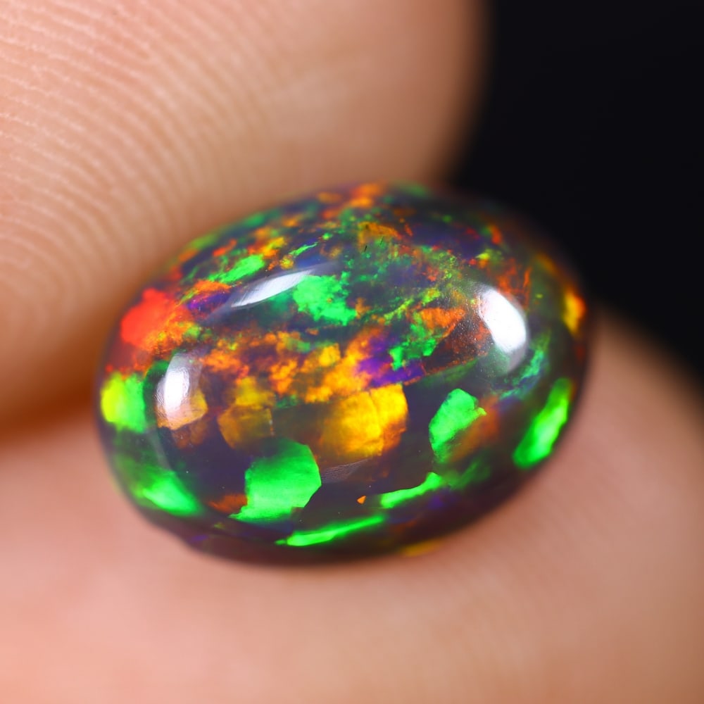 1.92Ct Welo Black Opal Polished - Ethiopian Opal , 840E: Ksmith Heritage Auctioneers Subject: Natural Ethiopian Welo Black Opal Origin: Ethiopia Carat Weight: 1.92Ct Dimension: 11x9.1x4 mm Treatment: Smoked Type: Cabochon, Polis