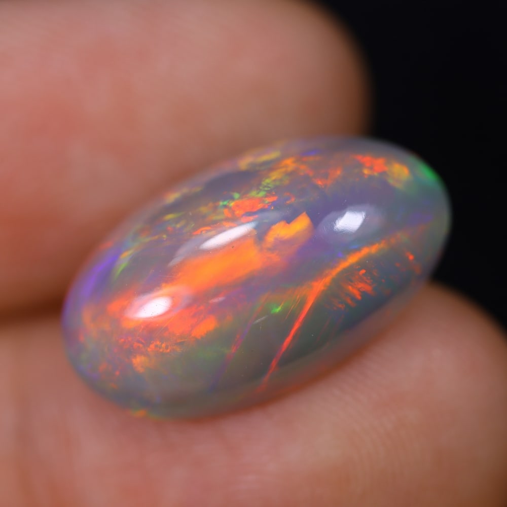 *7.03Ct Welo Opal Polished - Ethiopian Opal, 545B: Ksmith Heritage Auctioneers Subject: Natural Ethiopian Welo Opal Origin: Ethiopia Carat Weight: 7.03Ct Dimension: 18.6x10.9x6.9 mm Treatment: Natural Untreated Type: Cabochon,