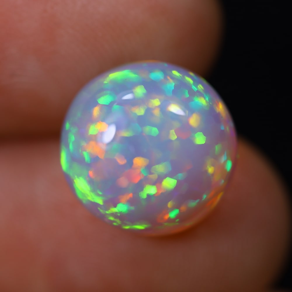 *4.27Ct Welo Opal Polished - Ethiopian Opal, 872B: Ksmith Heritage Auctioneers Subject: Natural Ethiopian Welo Opal Origin: Ethiopia Carat Weight: 4.27Ct Dimension: 12x11.7x5.8 mm Treatment: Natural Untreated Type: Cabochon, Po