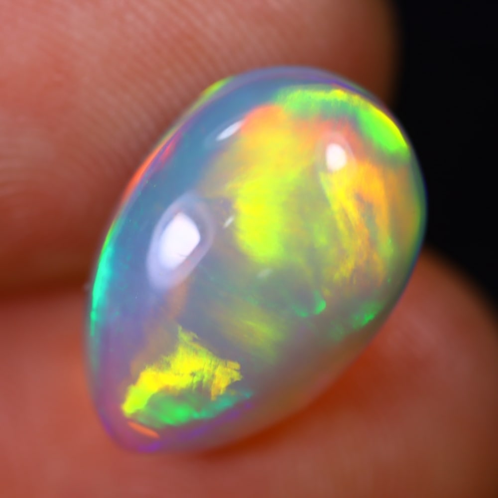 *4.98Ct Welo Opal Polished - Ethiopian Opal - Pear Cabochon, 764B: Ksmith Heritage Auctioneers Subject: Natural Ethiopian Welo Opal Origin: Ethiopia Carat Weight: 4.98Ct Dimension: 15.1 x 10.1 x 5.9 mm Treatment: Natural Untreated Shape: Pear
