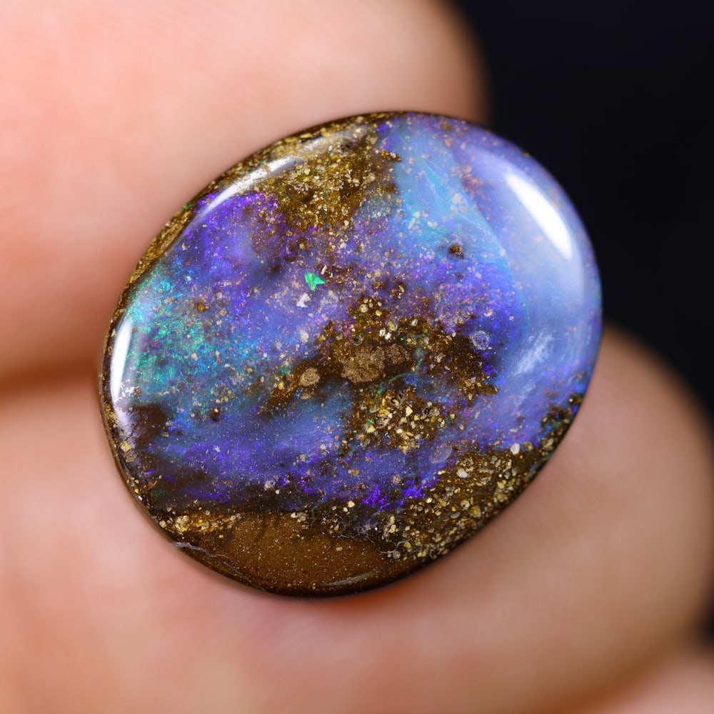 13.10Ct Blue Boulder Opal - Australian Opal , 79E: Ksmith Heritage Auctioneers Subject: Natural Boulder Opal Origin: Australia Carat Weight: 13.10Ct Dimension: 17.1x14.3x4.8 mm Treatment: Natural Untreated Type: Cabochon,