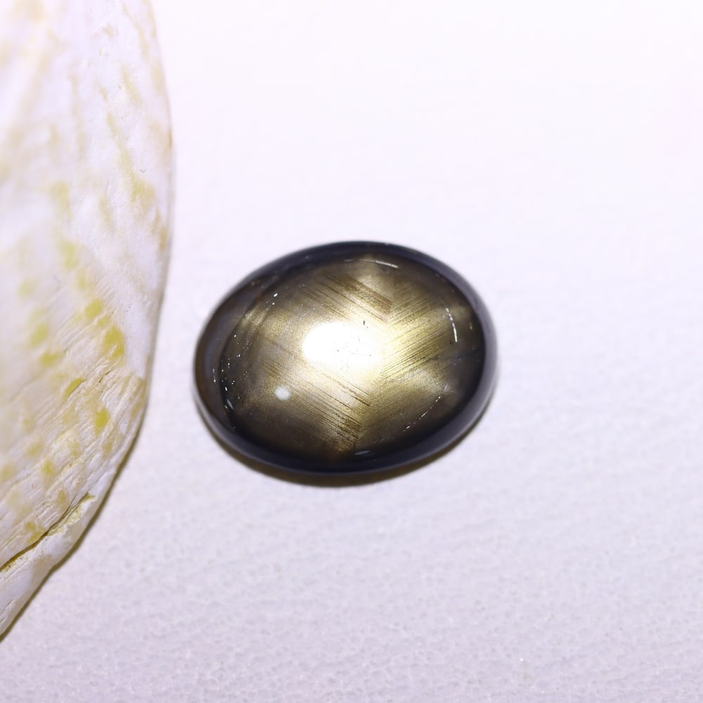 2.18cts 6 Rays Black Star Sapphire , 767B: Ksmith Heritage Auctioneers Subject: Natural 6 Rays Star Sapphire Origin: Myanmar Carat Weight: 2.18cts Dimension: 9.1x7x2.7 mm Treatment: Diffusion Type: Cabochon, Polished