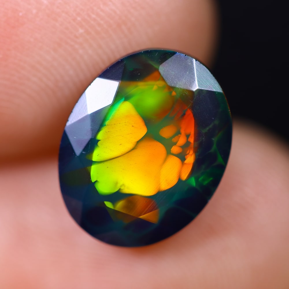 2.62Ct Welo Black Faceted Opal Polished - Ethiopian Opal , 836E: Ksmith Heritage Auctioneers Subject: Natural Ethiopian Welo Black Opal Origin: Ethiopia Carat Weight: 2.62Ct Dimension: 12.1x9.5x5.3 mm Treatment: Smoked Type: Faceted, Po