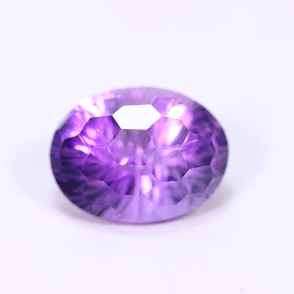 11.38Ct Purple Amethyst - Polished Faceted , 900E: Ksmith Heritage Auctioneers Subject: Natural Amethyst Origin: Brazil Carat Weight: 11.38Ct Dimension: 16.4x12.5x10.5 mm Treatment: Untreated Type: Faceted, Polished