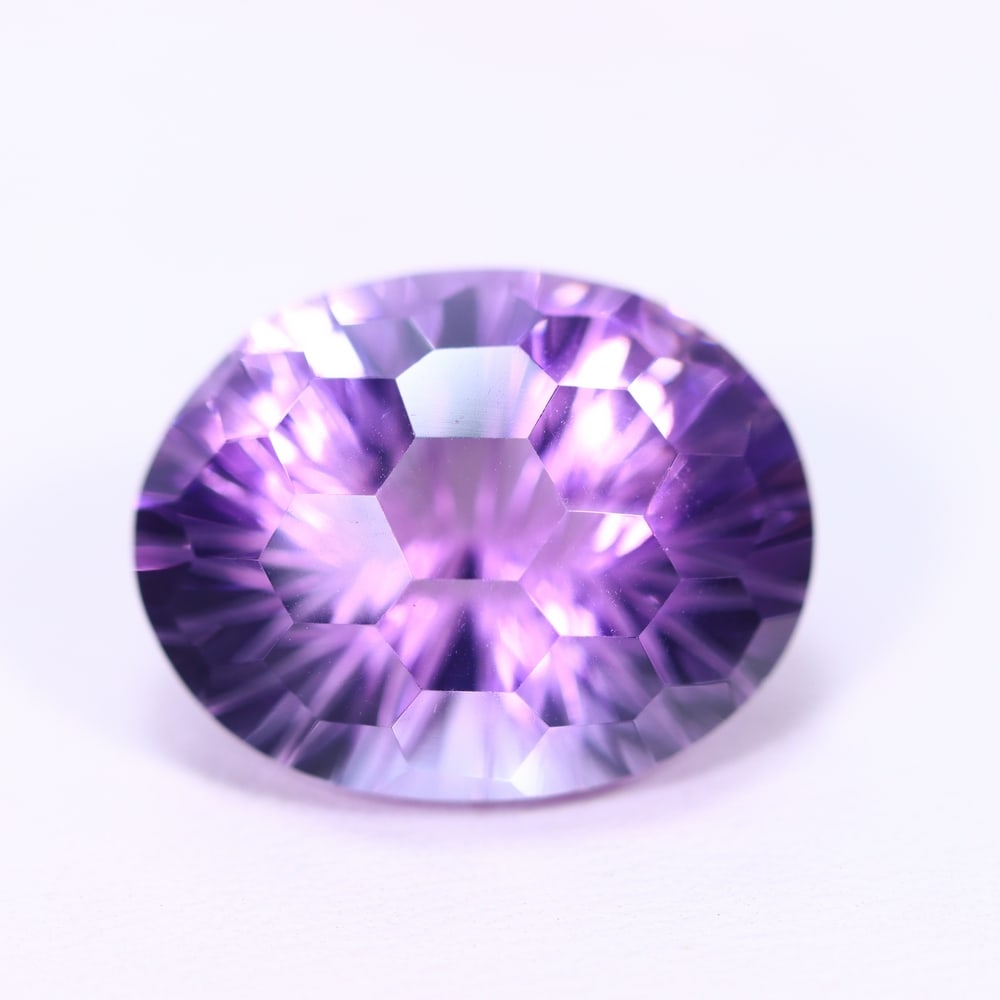 15.16Ct Purple Amethyst - Polished Faceted , 809E: Ksmith Heritage Auctioneers Subject: Natural Amethyst Origin: Brazil Carat Weight: 15.16Ct Dimension: 18.2x14.4x11.2 mm Treatment: Untreated Type: Faceted, Polished