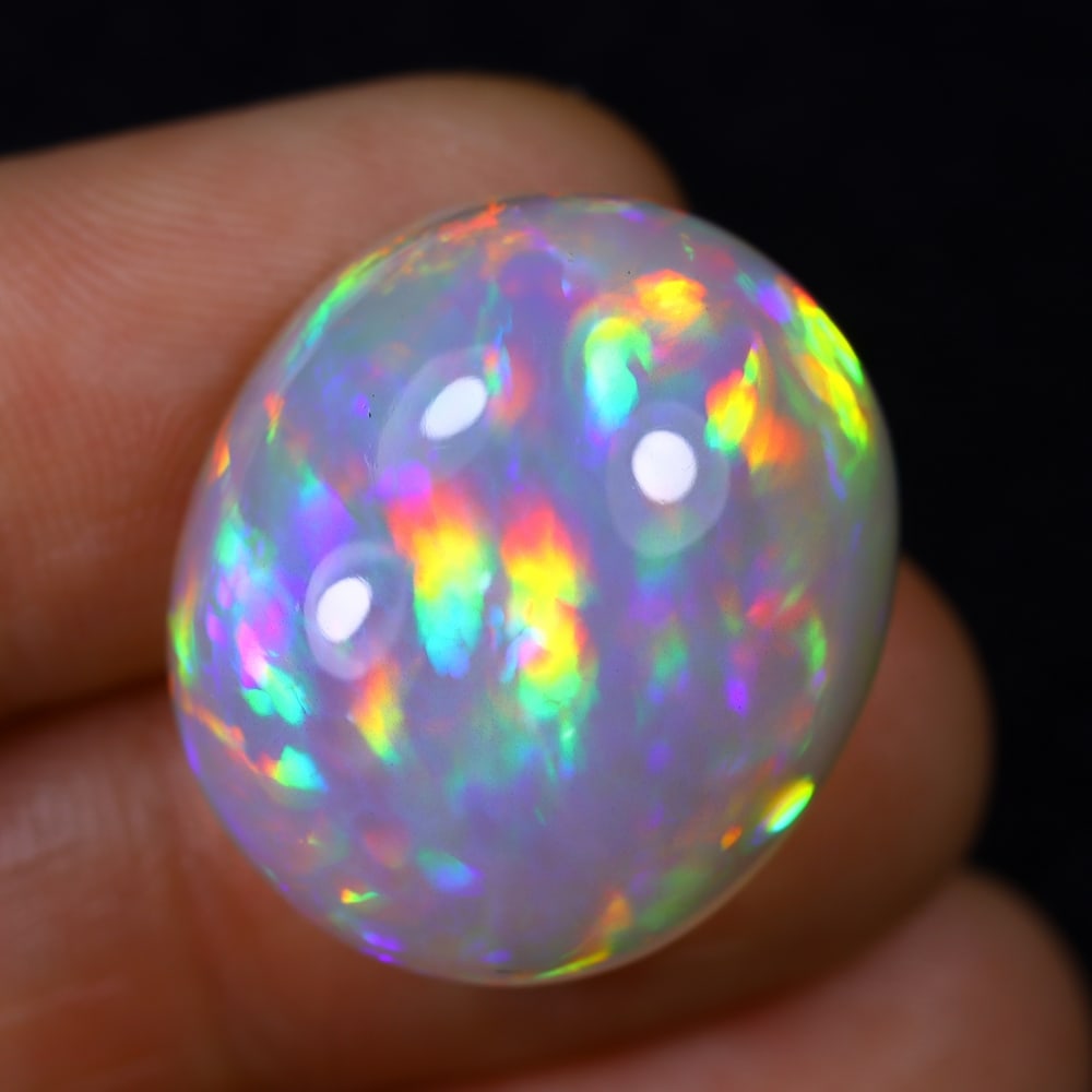 *28.11Ct Welo Opal Polished - Ethiopian Opal , 14E: Ksmith Heritage Auctioneers Subject: Natural Ethiopian Welo Opal Origin: Ethiopia Carat Weight: 28.11Ct Dimension: 22.4x19.4x11.6 mm Treatment: Natural Untreated Type: Cab