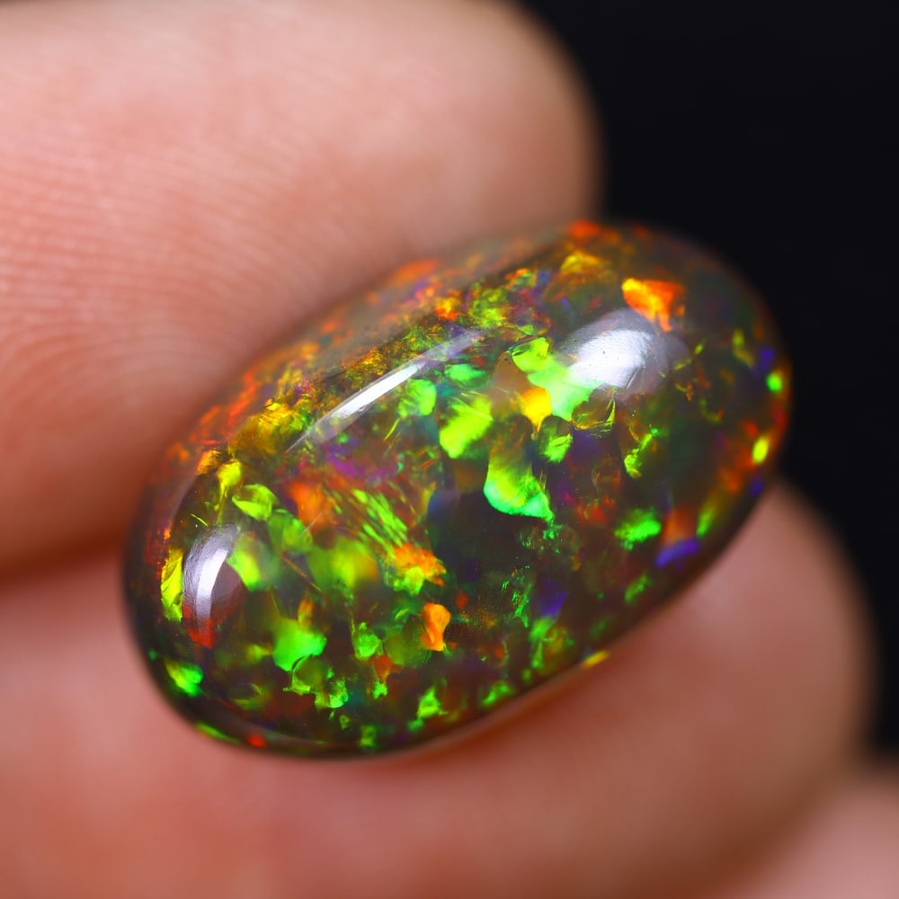 *8.47Ct Welo Black Opal Polished - Ethiopian Opal , 789E: Ksmith Heritage Auctioneers Subject: Natural Ethiopian Welo Black Opal Origin: Ethiopia Carat Weight: 8.47Ct Dimension: 18.7x11.4x6.5 mm Treatment: Smoked Type: Cabochon,