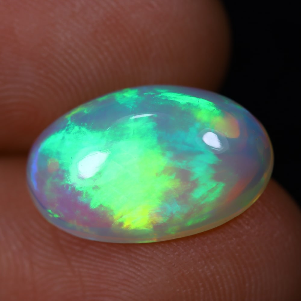 4.21Ct Welo Opal Polished - Ethiopian Opal, 906B: Ksmith Heritage Auctioneers Subject: Natural Ethiopian Welo Opal Origin: Ethiopia Carat Weight: 4.21Ct Dimension: 10.1x15.6x5.5 mm Treatment: Natural Untreated Type: Cabochon,