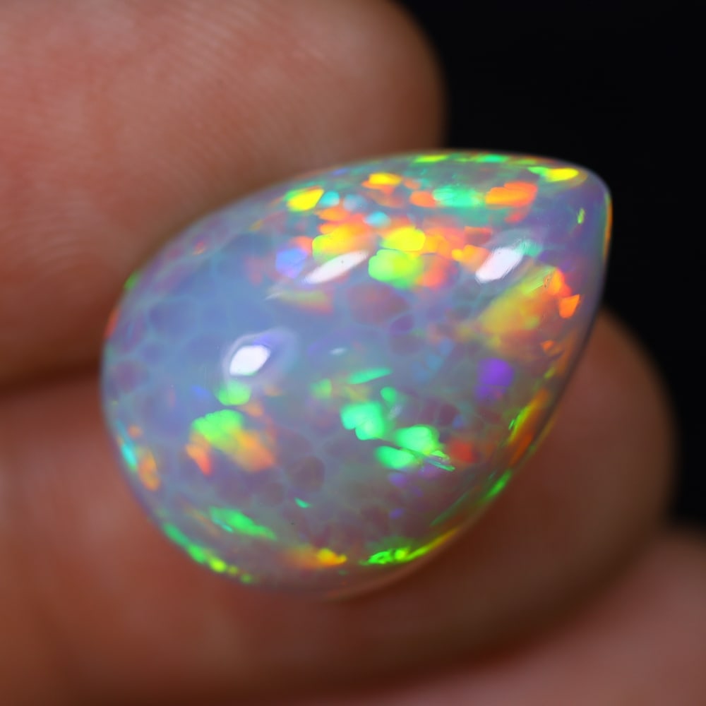*8.90Ct Welo Opal Polished - Ethiopian Opal, 548B: Ksmith Heritage Auctioneers Subject: Natural Ethiopian Welo Opal Origin: Ethiopia Carat Weight: 8.90Ct Dimension: 19.9x14.4x7.3 mm Treatment: Natural Untreated Type: Cabochon,