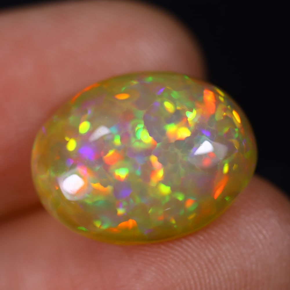 *5.77Ct Welo Opal Polished - Ethiopian Opal , 781E: Ksmith Heritage Auctioneers Subject: Natural Ethiopian Welo Opal Origin: Ethiopia Carat Weight: 5.77Ct Dimension: 16.1x12.5x5.5 mm Treatment: Natural Untreated Type: Caboc