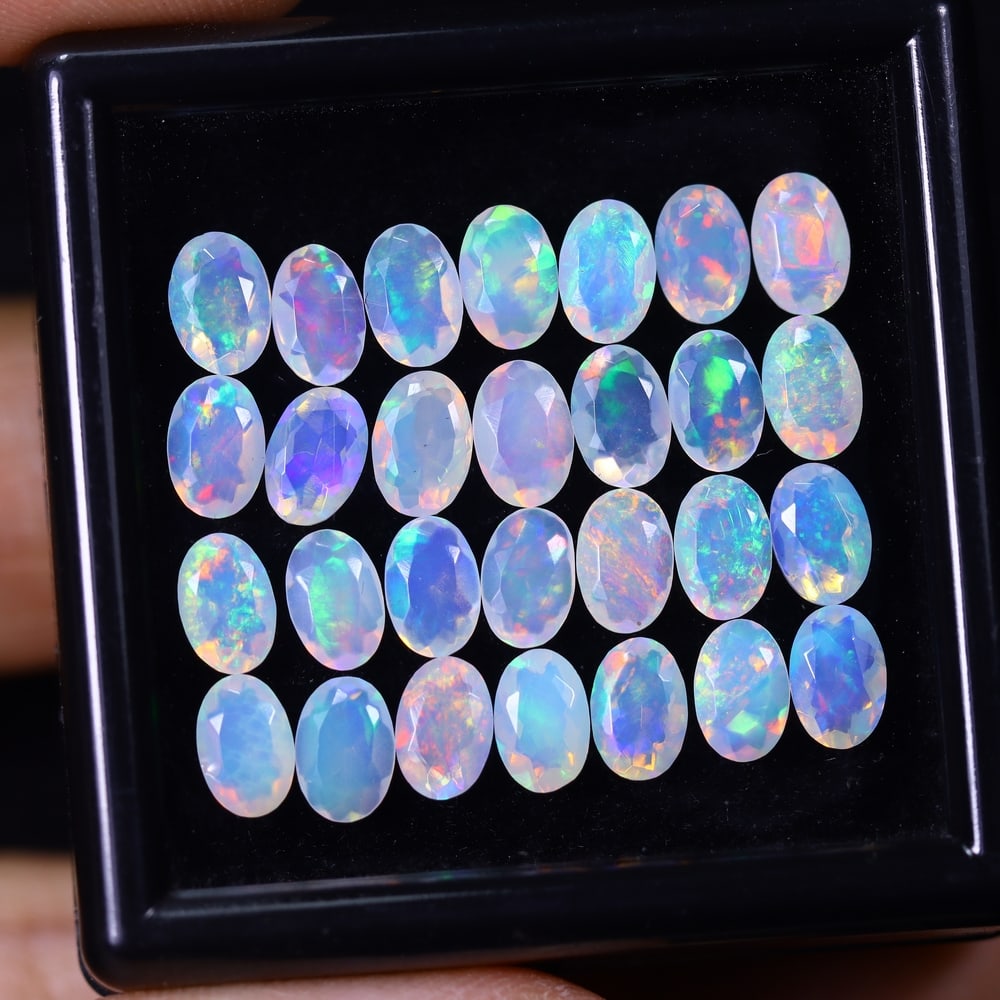 *8.16Ct 28pcs Calibrated 6x4mm Faceted Welo Opal Set - Ethiopian Opal, 552B: Ksmith Heritage Auctioneers Subject: Natural Ethiopian Welo Opal Origin: Ethiopia Carat Weight: 8.16Ct Treatment: Natural Untreated Type: Faceted, Polished
