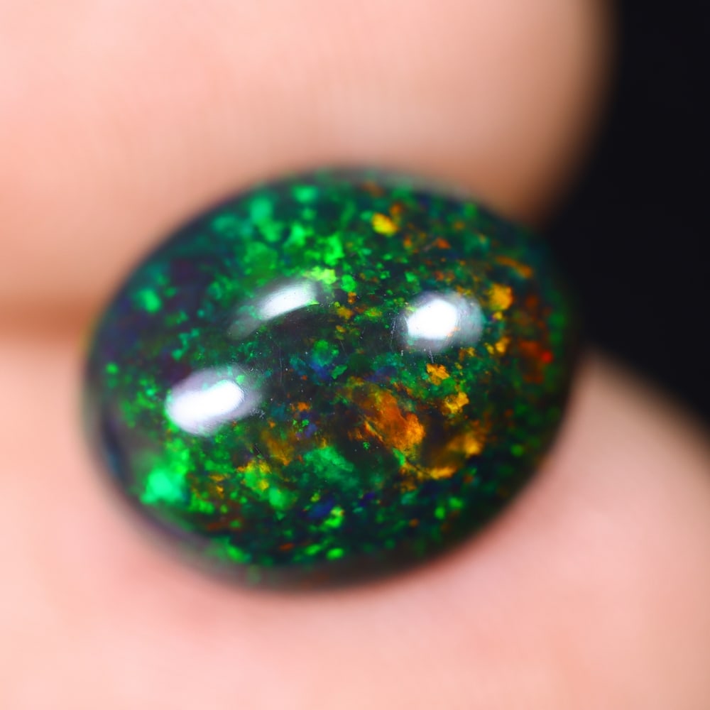 2.67Ct Welo Black Opal Polished - Ethiopian Opal , 778E: Ksmith Heritage Auctioneers Subject: Natural Ethiopian Welo Black Opal Origin: Ethiopia Carat Weight: 2.67Ct Dimension: 11.1x9.2x5.2 mm Treatment: Smoked Type: Cabochon, P