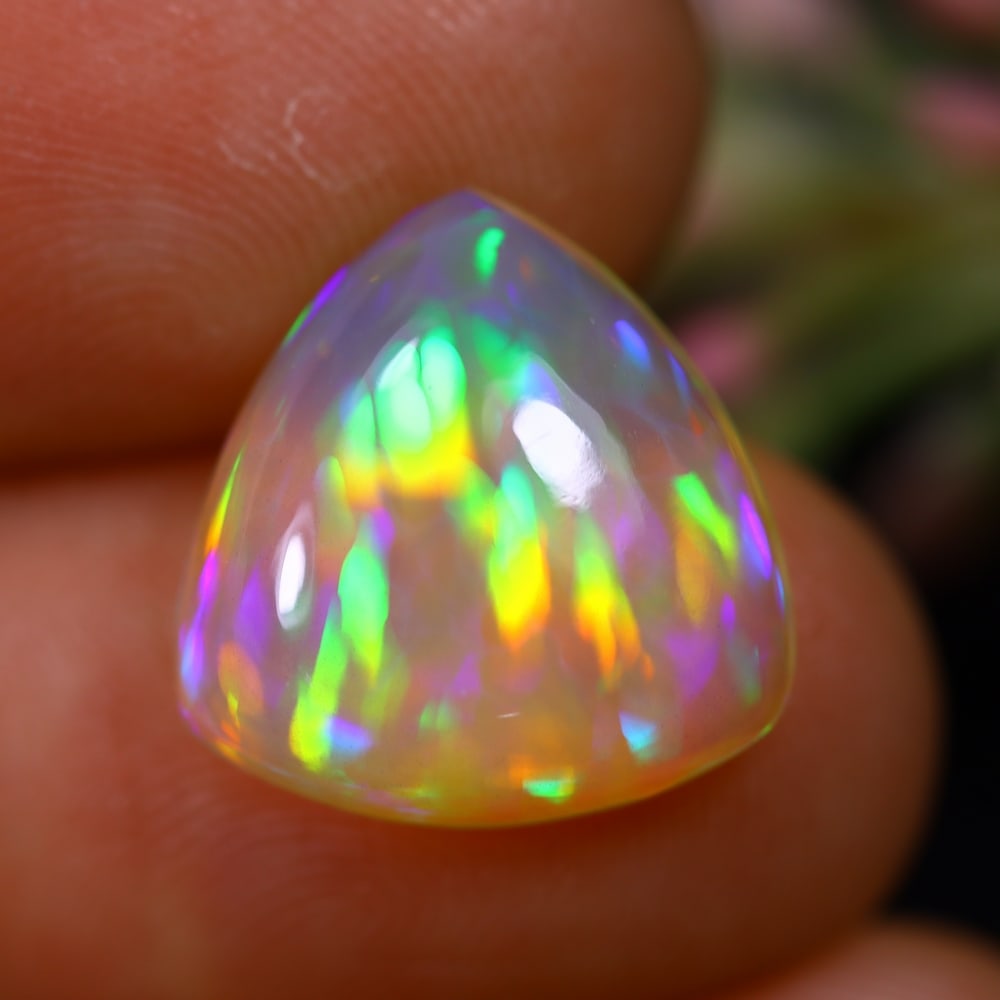 4.86Ct Welo Opal Polished - Ethiopian Opal - Triangle Cabochon, 668B: Ksmith Heritage Auctioneers Subject: Natural Ethiopian Welo Opal Origin: Ethiopia Carat Weight: 4.86Ct Dimension: 13.9x13.6x5.2 mm Treatment: Natural Untreated Shape: Triangle