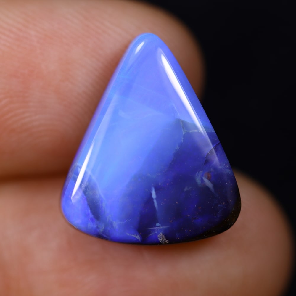 9.54Ct Blue Boulder Opal - Australian Opal , 104E: Ksmith Heritage Auctioneers Subject: Natural Boulder Opal Origin: Australia Carat Weight: 9.54Ct Dimension: 16.6x14x5.1 mm Treatment: Natural Untreated Type: Cabochon, Pol