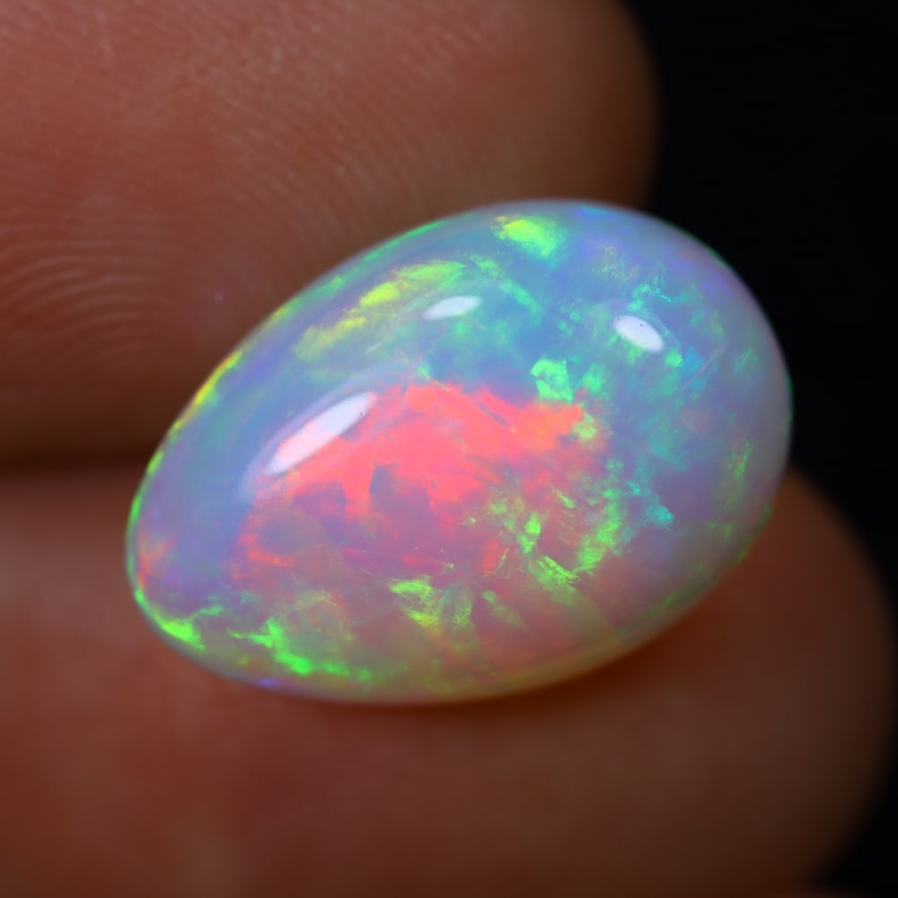 *6.13Ct Welo Opal Polished - Ethiopian Opal, 881B: Ksmith Heritage Auctioneers Subject: Natural Ethiopian Welo Opal Origin: Ethiopia Carat Weight: 6.13Ct Dimension: 16x11.6x6.3 mm Treatment: Natural Untreated Type: Cabochon, Po
