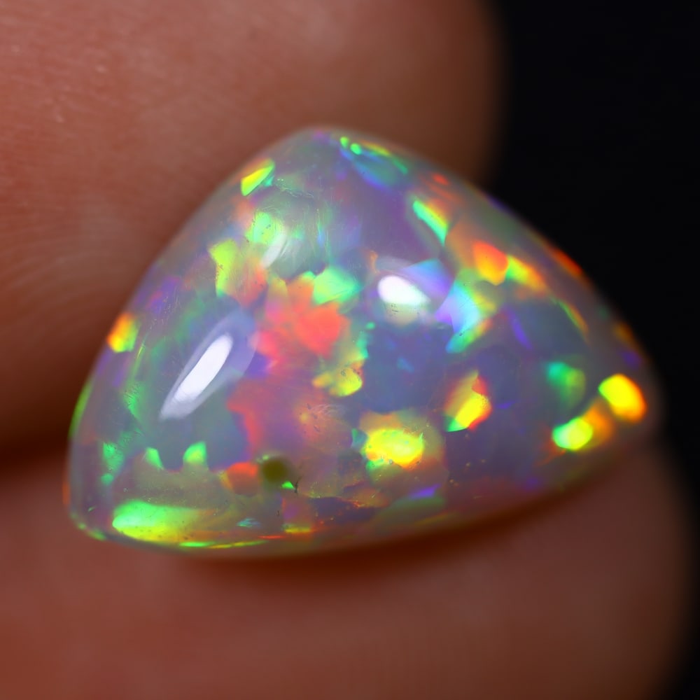 *5.35Ct Welo Opal Polished - Ethiopian Opal , 42E: Ksmith Heritage Auctioneers Subject: Natural Ethiopian Welo Opal Origin: Ethiopia Carat Weight: 5.35Ct Dimension: 16.5x10.4x6.4 mm Treatment: Natural Untreated Type: Caboc
