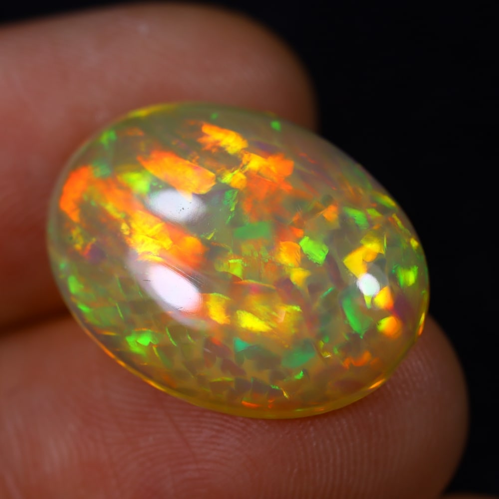 *7.51Ct Welo Opal Polished - Ethiopian Opal , 886E: Ksmith Heritage Auctioneers Subject: Natural Ethiopian Welo Opal Origin: Ethiopia Carat Weight: 7.51Ct Dimension: 19.8x14.8x5 mm Treatment: Natural Untreated Type: Cabocho