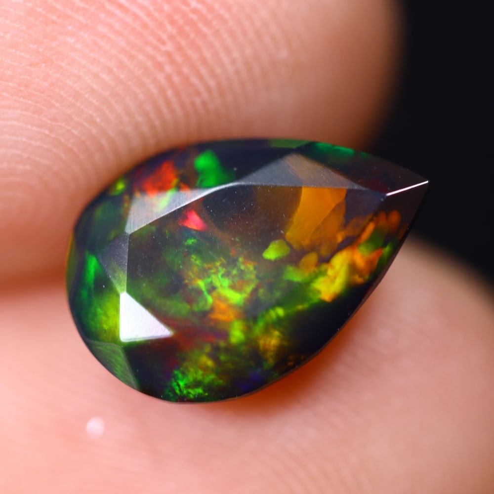 1.84Ct Welo Black Opal Faceted Polished - Ethiopian Opal , 790E: Ksmith Heritage Auctioneers Subject: Natural Ethiopian Welo Black Opal Origin: Ethiopia Carat Weight: 1.84Ct Dimension: 12.1x8.3x5.6 mm Treatment: Smoked Type: Faceted, Po