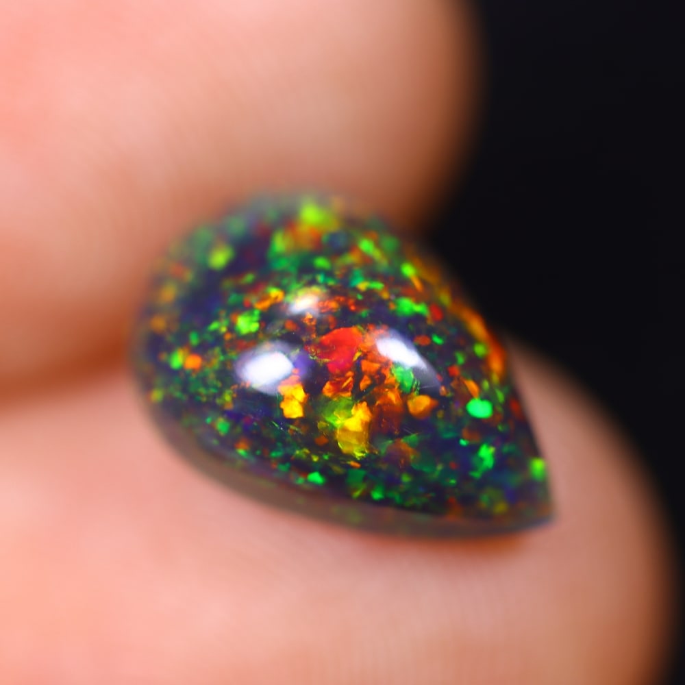 1.89Ct Welo Black Opal Polished - Ethiopian Opal , 759E: Ksmith Heritage Auctioneers Subject: Natural Ethiopian Welo Black Opal Origin: Ethiopia Carat Weight: 1.89Ct Dimension: 12.1x8.3x4.7 mm Treatment: Smoked Type: Cabochon, P