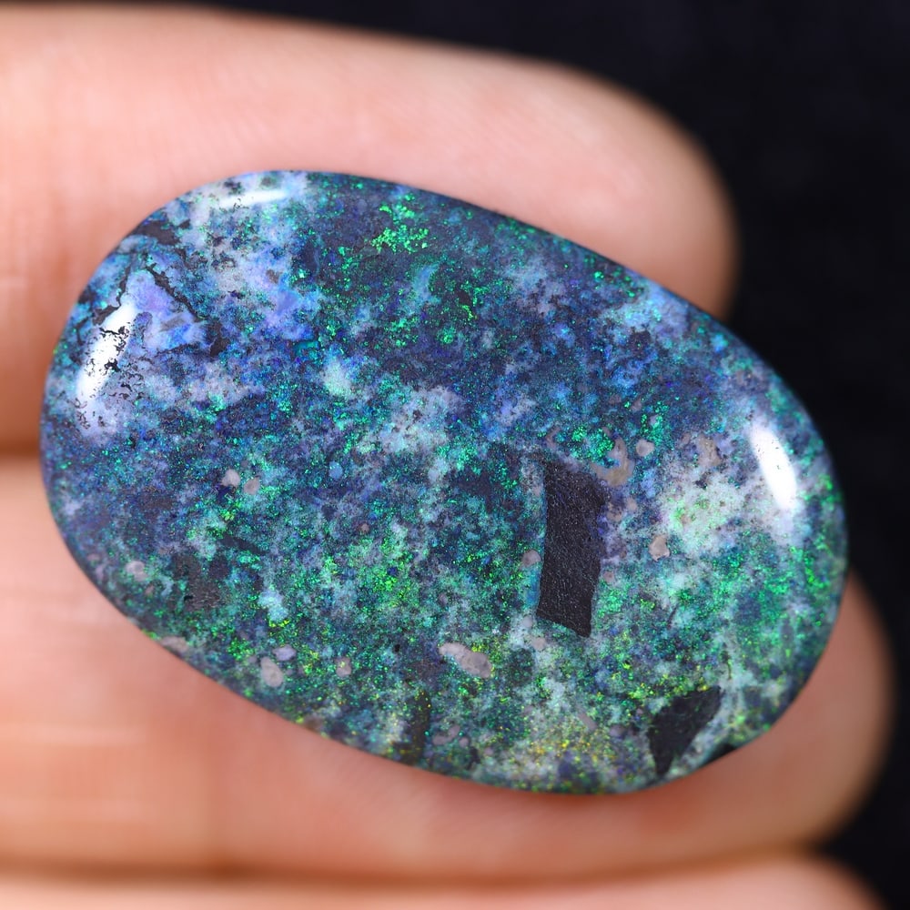 19.49Ct Andamooka Opal - Australian Opal, 695B: Ksmith Heritage Auctioneers Subject: Natural Andamooka Opal Origin: Australia Carat Weight: 19.49Ct Dimension: 28.1x19x5 mm Treatment: Sugar Treated Type: Cabochon, Polished