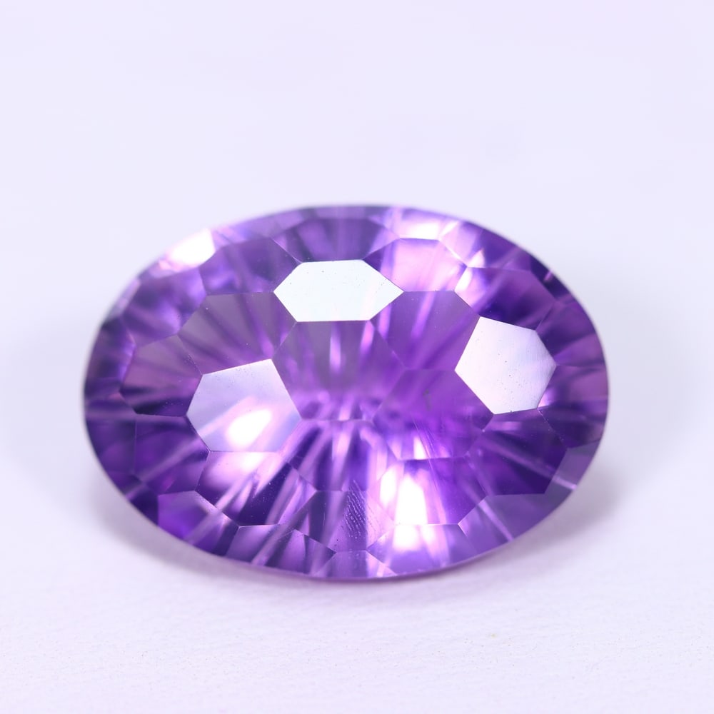 15.59Ct Purple Amethyst - Polished Faceted, 801B: Ksmith Heritage Auctioneers Subject: Natural Amethyst Origin: Brazil Carat Weight: 15.59Ct Dimension: 20x14.1x10.2 mm Treatment: Untreated Type: Faceted, Polished