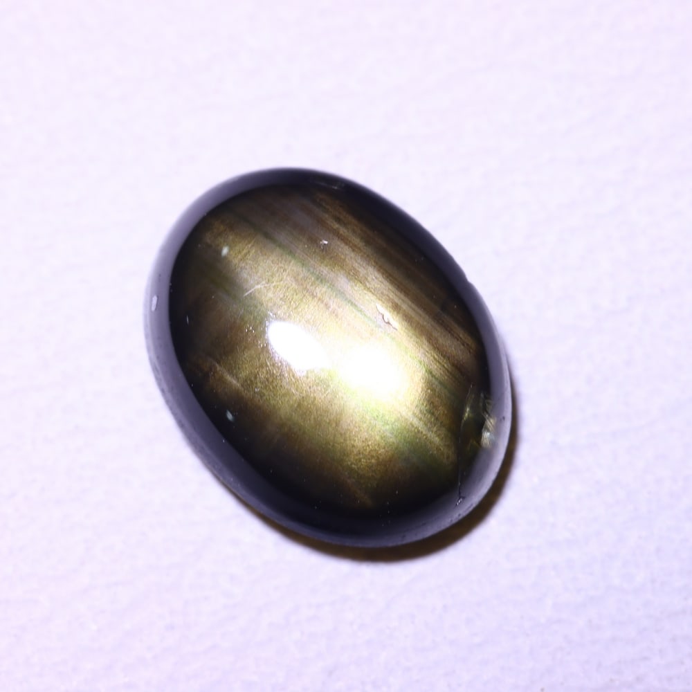 2.62cts 6 Rays Black Star Sapphire , 828E: Ksmith Heritage Auctioneers Subject: Natural 6 Rays Star Sapphire Origin: Myanmar Carat Weight: 2.62cts Dimension: 8.9x6.8x3.3 mm Treatment: Diffusion Type: Cabochon, Poli