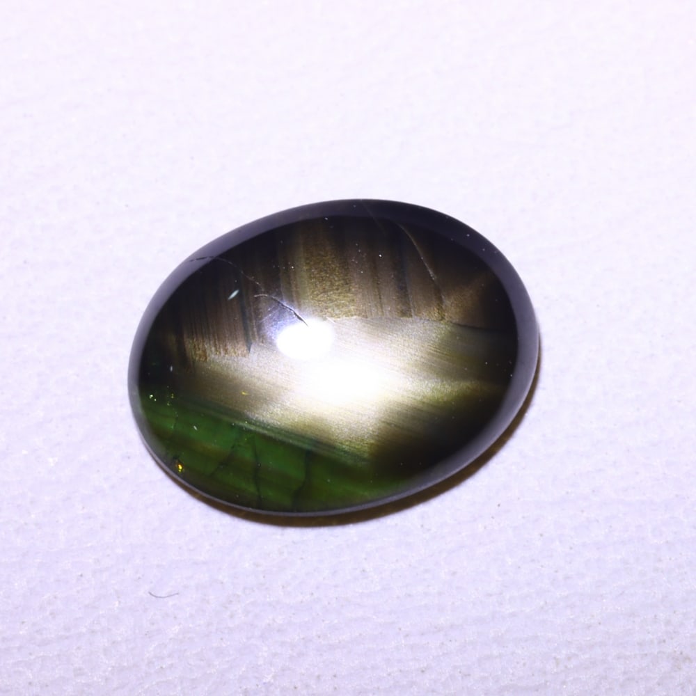 1.90cts 6 Rays Black Star Sapphire , 757E: Ksmith Heritage Auctioneers Subject: Natural 6 Rays Star Sapphire Origin: Myanmar Carat Weight: 1.90 cts Dimension: 8.9x6.6x2.5 mm Treatment: Diffusion Type: Cabochon, Pol