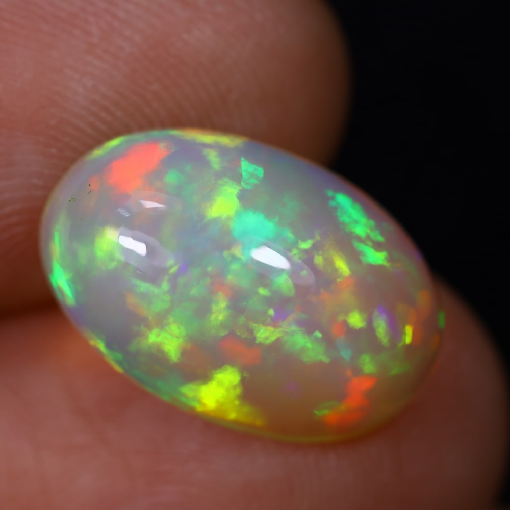 4.81Ct Welo Opal Polished - Ethiopian Opal, 1241B: Ksmith Heritage Auctioneers Subject: Natural Ethiopian Welo Opal Origin: Ethiopia Carat Weight: 4.81Ct Dimension: 15.7x10.4x7.2 mm Treatment: Natural Untreated Type: Cabochon,