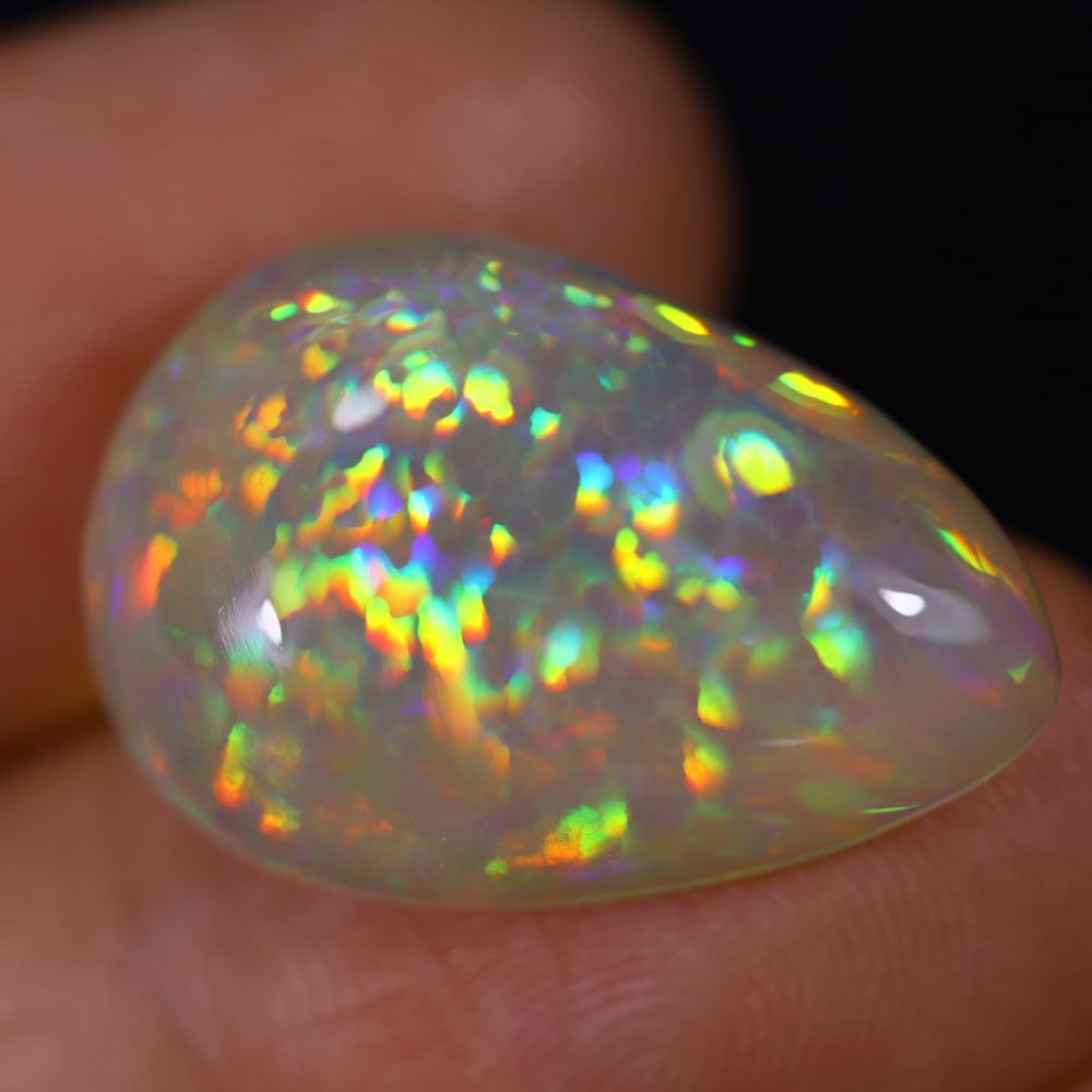 *11.38Ct Welo Opal Polished - Ethiopian Opal , 294E: Ksmith Heritage Auctioneers Subject: Natural Ethiopian Welo Opal Origin: Ethiopia Carat Weight: 11.38Ct Dimension: 21.3x14.6x7 mm Treatment: Natural Untreated Type: Caboch