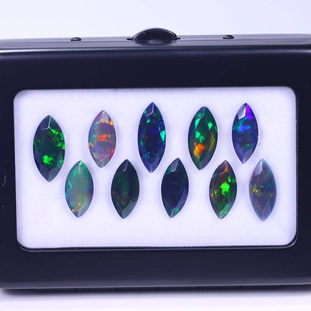 *13.57Ct 10pcs Faceted Smoked Welo Opal Set - Ethiopian Opal, 1047B: Ksmith Heritage Auctioneers Subject: Natural Ethiopian Black Welo Opal Origin: Ethiopia Carat Weight: 13.57Ct Dimension: 13x5x3 mm Treatment: Heated Type: Faceted, Polished