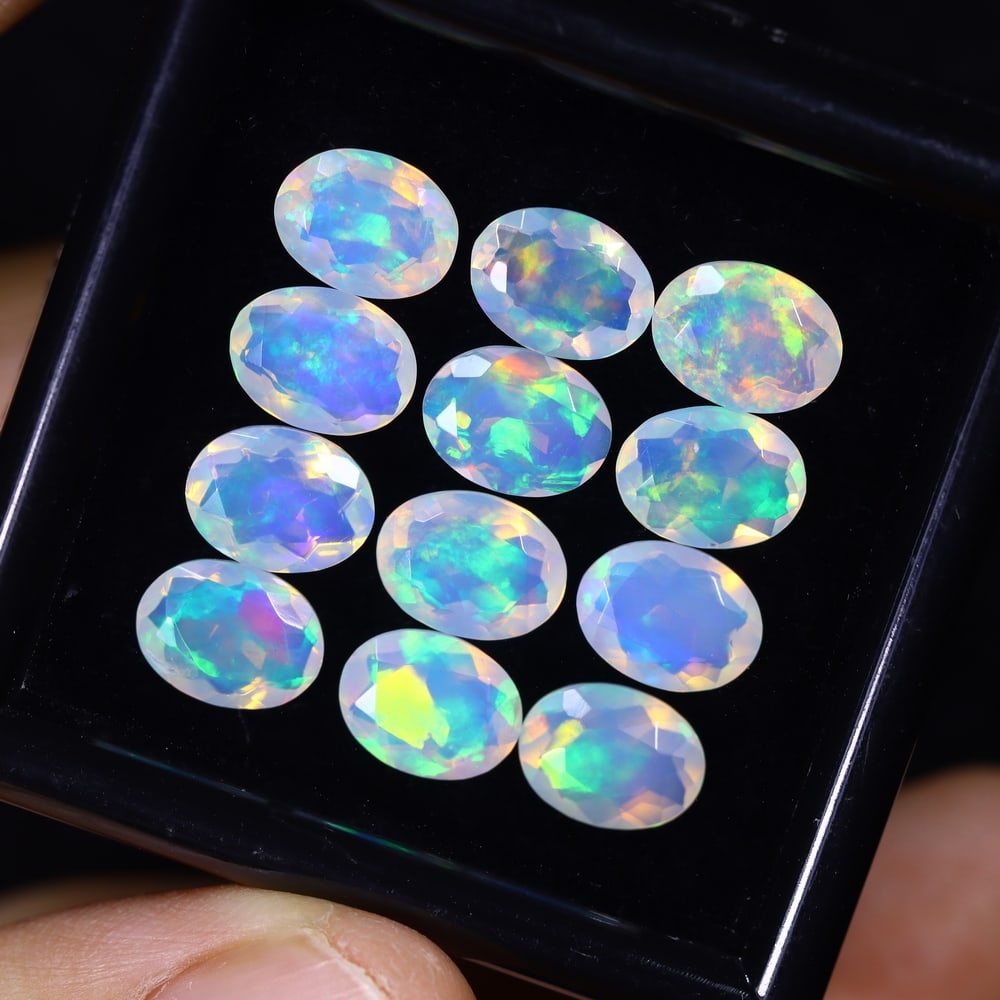 *9.28Ct 12pcs Calibrated 8x6mm Faceted Welo Opal Set - Ethiopian Opal , 502E: Ksmith Heritage Auctioneers Subject: Natural Ethiopian Welo Opal Origin: Ethiopia Carat Weight: 9.28Ct Treatment: Natural Untreated Type: Faceted, Polished
