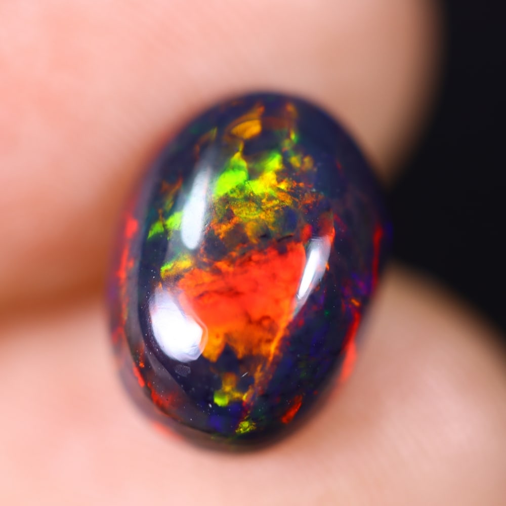 1.93Ct Welo Black Opal Polished - Ethiopian Opal , 474E: Ksmith Heritage Auctioneers Subject: Natural Ethiopian Welo Black Opal Origin: Ethiopia Carat Weight: 1.93Ct Dimension: 11.1x8.1x4.6 mm Treatment: Smoked Type: Cabochon, P