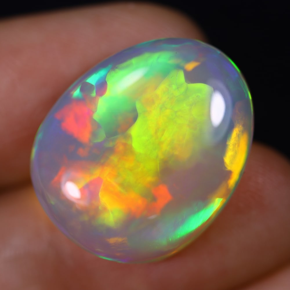 *17.34Ct Welo Opal Polished - Ethiopian Opal, 1075B: Ksmith Heritage Auctioneers Subject: Natural Ethiopian Welo Opal Origin: Ethiopia Carat Weight: 17.34Ct Dimension: 21.5x17.6x8.6 mm Treatment: Natural Untreated Type: Cabochon,