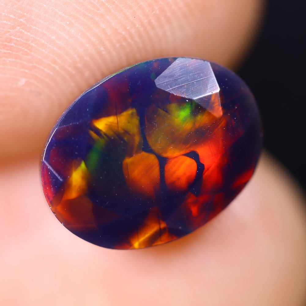 1.98Ct Welo Black Opal Polished - Ethiopian Opal , 715E: Ksmith Heritage Auctioneers Subject: Natural Ethiopian Welo Black Opal Origin: Ethiopia Carat Weight: 1.98Ct Dimension: 11.1x8.5x5.1 mm Treatment: Smoked Type: Faceted, Po