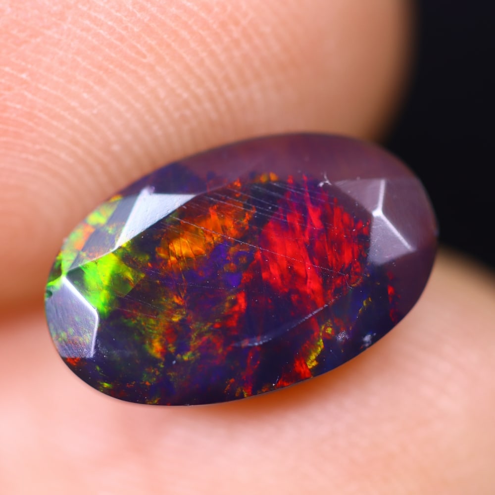 1.77Ct Welo Black Opal Polished - Ethiopian Opal , 415E: Ksmith Heritage Auctioneers Subject: Natural Ethiopian Welo Black Opal Origin: Ethiopia Carat Weight: 1.77Ct Dimension: 11.9x7.5x4.7 mm Treatment: Smoked Type: Faceted, Po